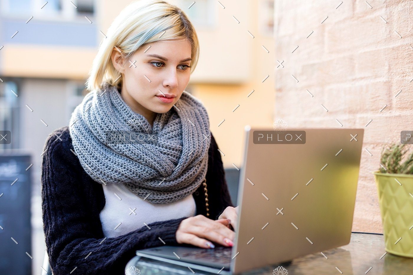 demo-attachment-40-young-focused-woman-working-on-laptop-at-outdoor-PTTFVNE